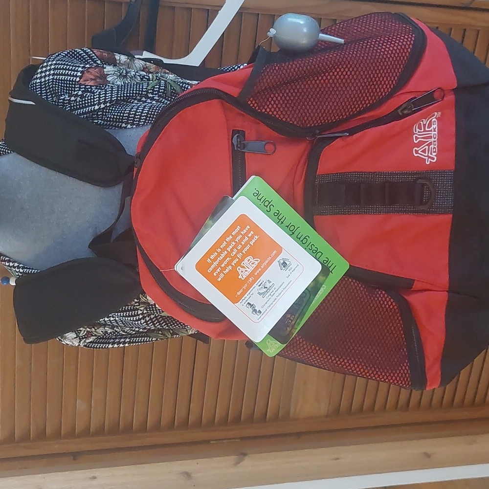 Air packs multiple function back pack NEW WITH TAGS. Red black zip pockets